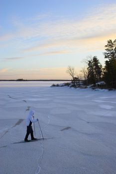 Cross-country winter skiing on the lake�s ice in Voyager National Park