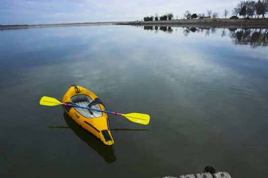 Orange kayak on the lake at sunset in Nebraska