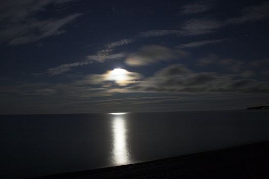 Nighttime mmon over lake superior near Grand Marais Minnesota