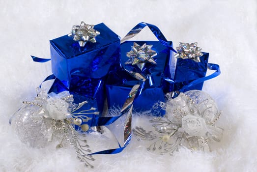 Blue boxes and Christmas decoratoins on the white skin