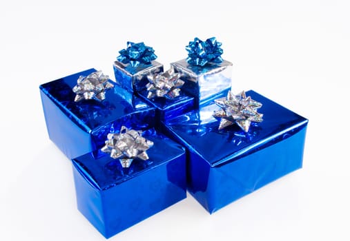 Blue shiny boxes for gifts with ribbons