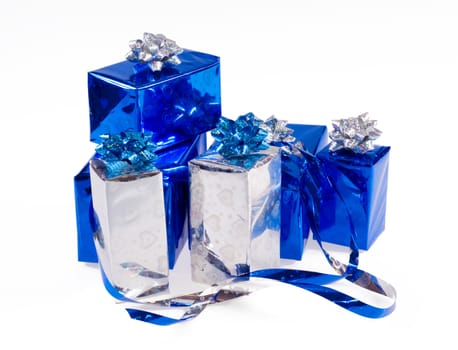 Many blue shiny boxes for gifts with ribbons