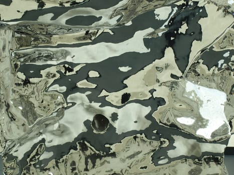 Detail of rippled reflective metal surface