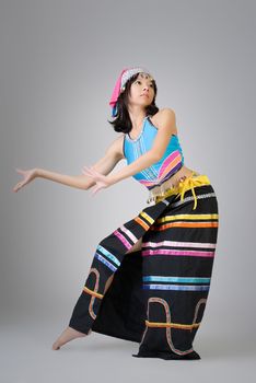 Attractive Chinese dancer in colorful traditional dress, Dai ethnic.