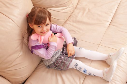 people series: little girl on the sofa with toy