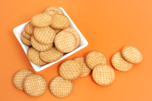 An image of some nice cracker on orange background