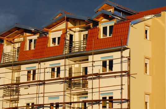 scaffolding on building wall,  on construction site