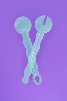 An image of nice salad servers on purple background