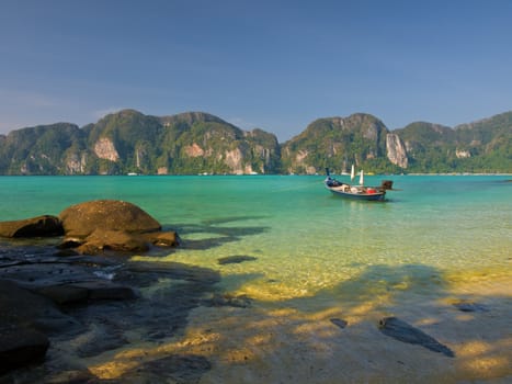 Traditional Thai longtail boat in a lagoon on Koh Phi-Phi Don island.