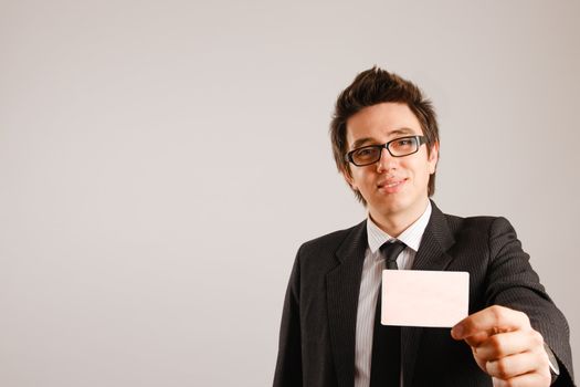 Business man holding blank business card