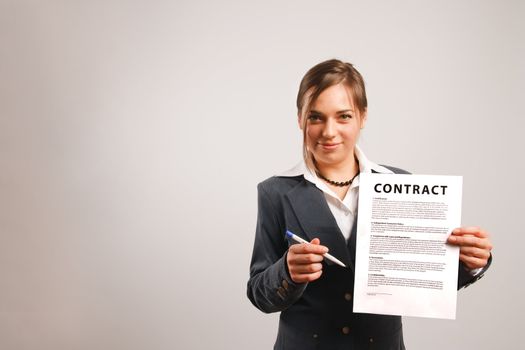 Business woman holding a printed contract