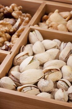 Nuts of different grades in a wooden box.