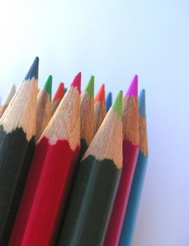 pencil crayons against a blue background