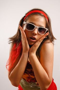 Modern looking young woman wearing sun glasses