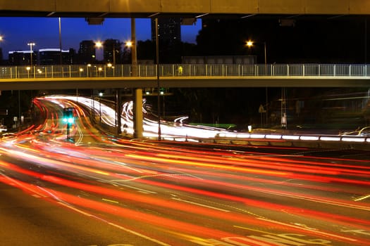 High traffic street in a rush-hour at night .