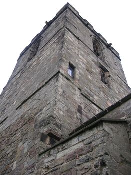 looking directly up at a old church tower