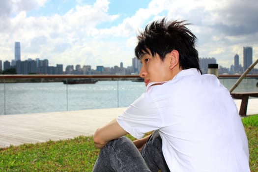 portrait of a young business man in the park at day