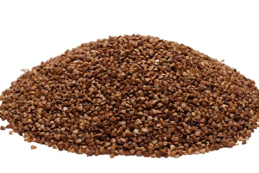 Heap buckwheat croups, disposit on white background