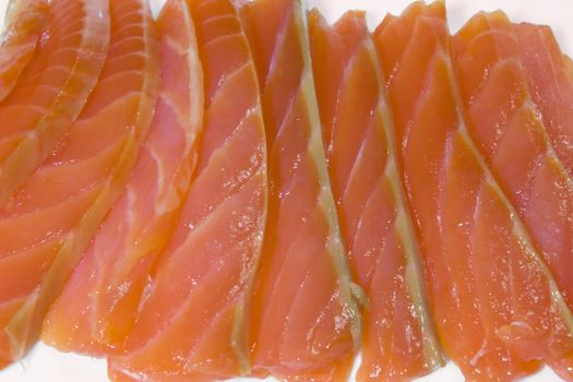 Slices of a salmon, photo close up on a white background.