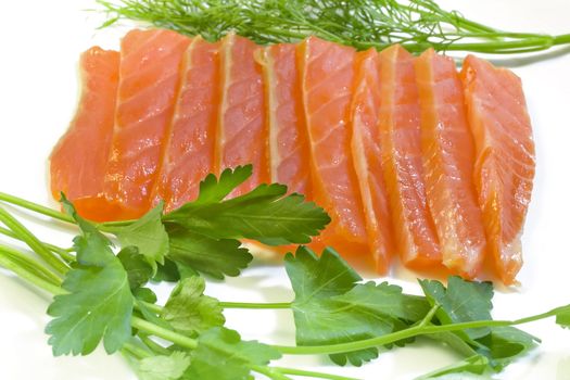 Salmon with fennel and parsley, a photo close up on a white background.