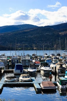 small lake pier with boats view in a sunny day