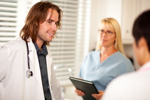 Doctors and Nurses Having A Casual Conversation in The Office.