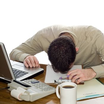 A depressed businessman lying with his head on his desk, isolated against a white background