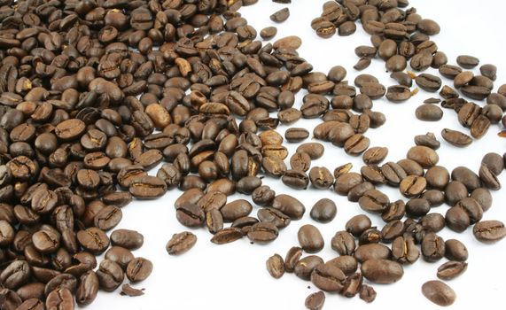 Coffee Beans spread on a white background
