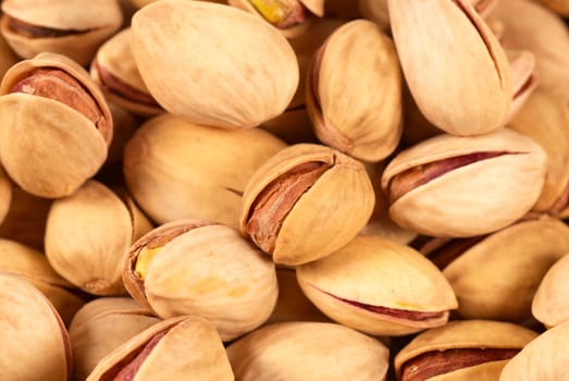 A backround of piled up pistachio nuts