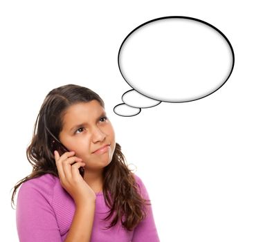 Frowning Hispanic Teen Aged on Cell Phone with Blank Thought Bubble Isolated on a White Background - Contains Clipping Paths.