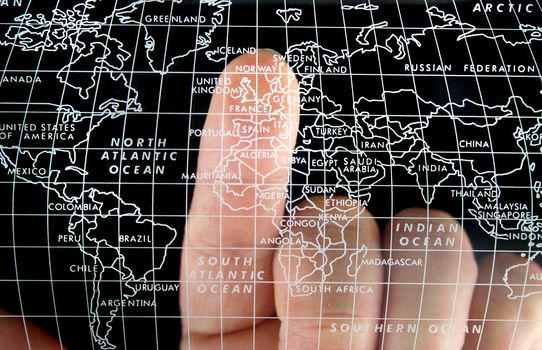 Map with Finger on the Uk
