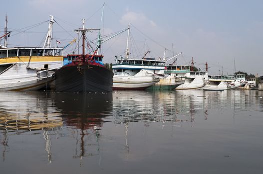 Boats docked in Jakarta old harbor, Indonesia