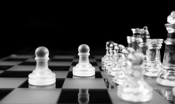 Glass Chess Pieces on a Frosted Glass Chess Board

