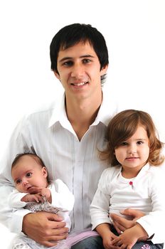 young father holding his children in his arms and smiling