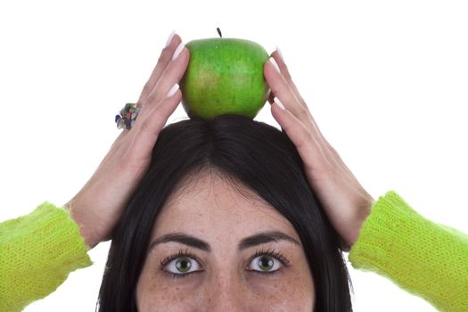 young woman holding healthy green apple above the head isolated on white background