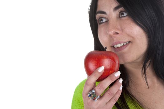 young woman holding healthy red apple in the hands isolated on white background