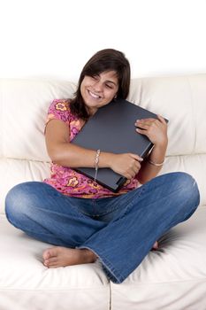 beautiful teenager holding laptop computer - lifestyle concept