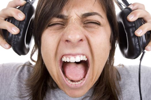 teenager shouting with headphones isolated on white background