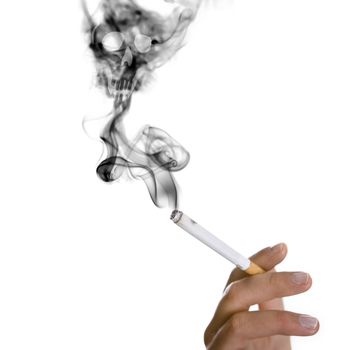 smoker hand holding cigarette - skull apearing in the smoke - health concept