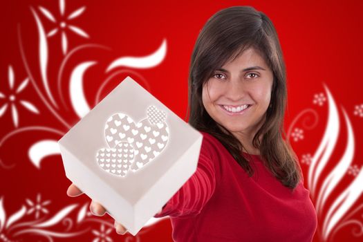 beautiful young woman with valentine present box over red background