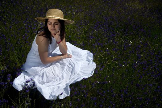 beautiful woman in white dress relaxing in the nature