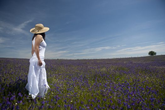 beautiful woman in white dress relaxing in the nature