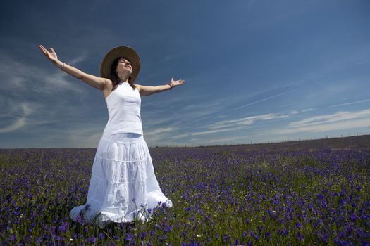 beautiful woman in white dress with arms wide open