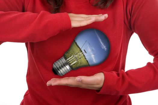 young woman holding light bulb - environmental concept