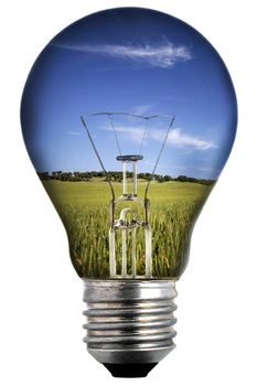 light bulb with landscape inside isolated on white - environmental concept