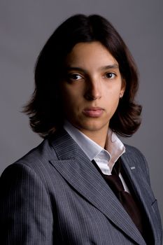 businesswoman headshot portrait. grey background.