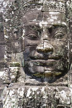 Image of Buddha's face at UNESCO's World Heritage Site of Bayon, which is part of the larger temple complex of Angkor Thom, located at Siem Reap, Cambodia. This is one of the temples in Siem Reap where the Hollywood movie Lara Croft Tomb Raider was filmed at.