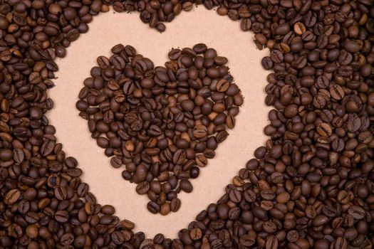 heart shape background made with coffee beans. Landscape orientation.
