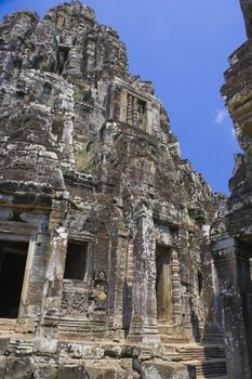 Image of UNESCO's World Heritage Site of Bayon, which is part of the larger temple complex of Angkor Thom, located at Siem Reap, Cambodia. This is one of the temples in Siem Reap where the Hollywood movie Lara Croft Tomb Raider was filmed at.