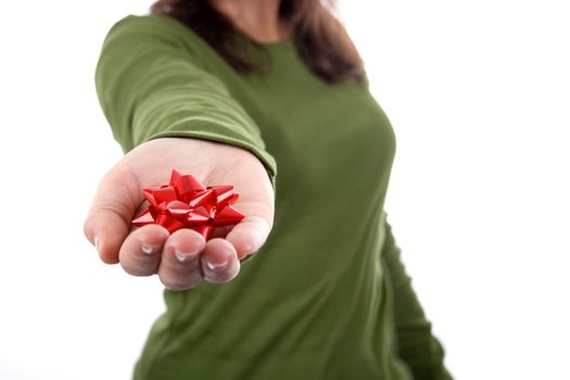 woman in green shirt holding red ribbon in the hand. isolated on white background. landscape orientation.